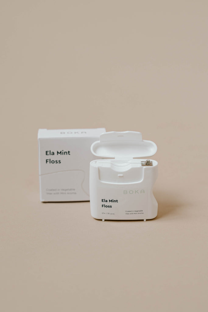 Opened container of Boka Ela Mint floss